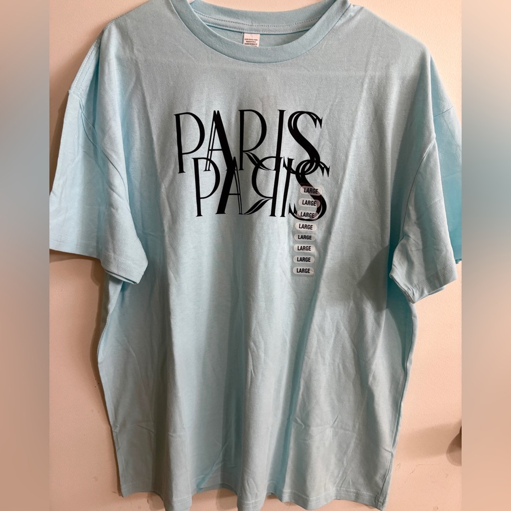 Woman’s Large Light Blue Paris shirt NEW WITH TAGS
NEW WITH TAGS